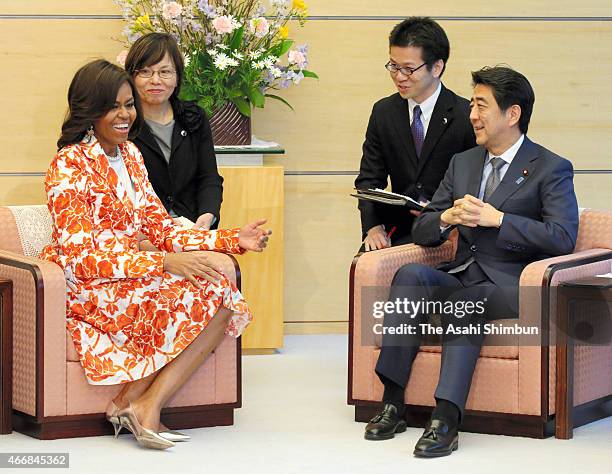 First lady Michelle Obama and Japanese Prime Minister Shinzo Abe talk during their meeting at Abe's official residence on March 19, 2015 in Tokyo,...