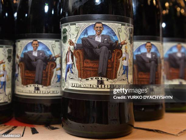 Closeup taken at the Beer Theater, a restaurant in the western Ukrainian city of Lviv, shows on March 19, 2015 a bottle of Obama Hoped stout brewed...