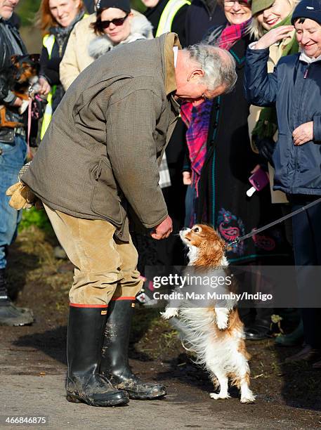 Prince Charles, Prince of Wales meets local people before travelling aboard a boat to visit the flood hit village of Muchelney on February 4, 2014...