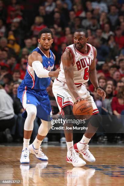 Mike James of the Chicago Bulls handles the ball against the Los Angeles Clippers on January 24, 2014 at the United Center in Chicago, Illinois. NOTE...