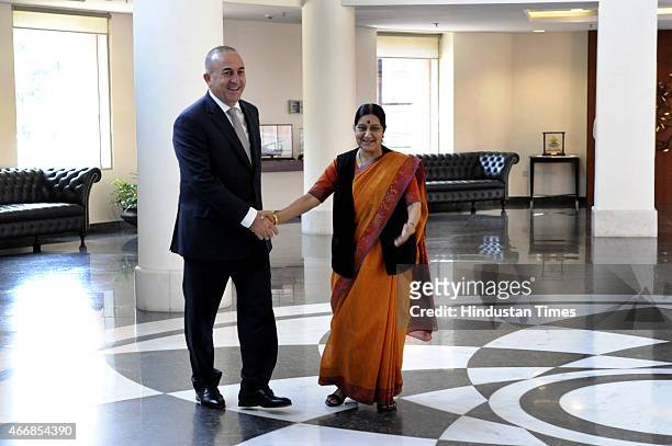 External Affairs Minister Sushma Swaraj with her Turkish Minister of Foreign Affairs Mevlut Cavusoglu on March 19, 2015 in New Delhi, India. India...