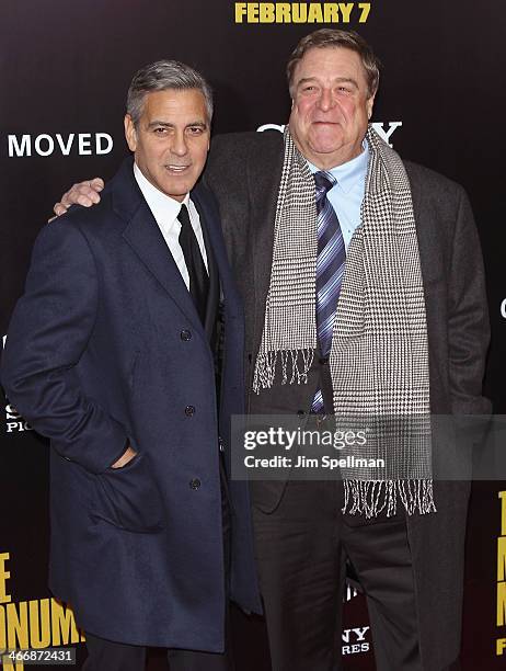 Actor/director George Clooney and actor John Goodman attends "The Monuments Men" premiere at Ziegfeld Theater on February 4, 2014 in New York City.