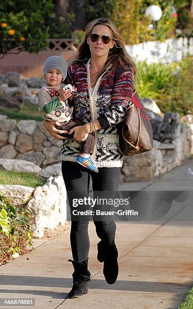 Molly Sims is seen with her son Brooks Stuber on February 04, 2014 in Los Angeles, California.