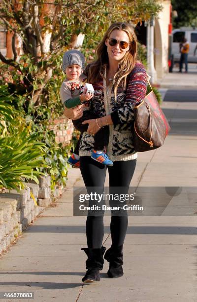 Molly Sims is seen with her son Brooks Stuber on February 04, 2014 in Los Angeles, California.