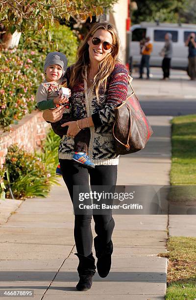 Molly Sims is seen with her son Brooks Stuber on February 04, 2014 in Los Angeles, California.