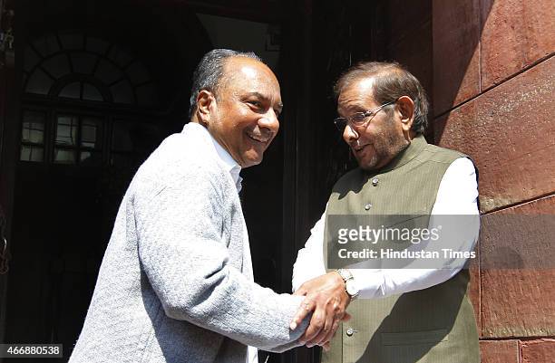 Congress leader AK Antony with JD Leader Sharad Yadav at Parliament House on March 19, 2015 in New Delhi, India. Opposition forced deferment of...