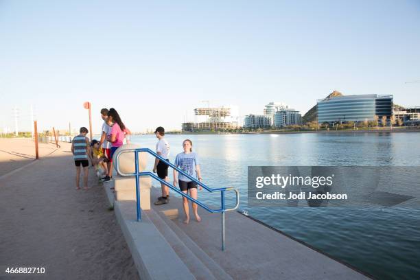 love local: teens along salt river in tempe, arizona - tempe arizona stock pictures, royalty-free photos & images