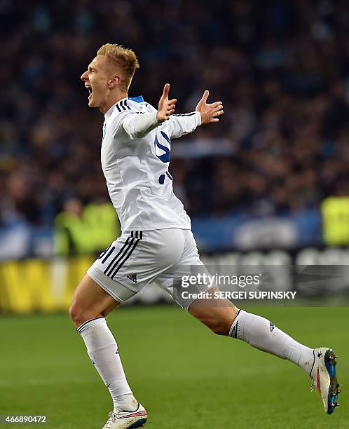 Dynamo Kiev's Polish forward Lukasz Teodorczyk celebrates after scoring a goal during the UEFA Europa League round of 16 football match between...