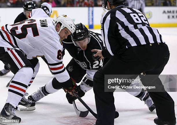 Andrew Shaw of the Chicago Blackhawks takes a face-off against Colin Fraser of the Los Angeles Kings in the second period during the NHL game at...