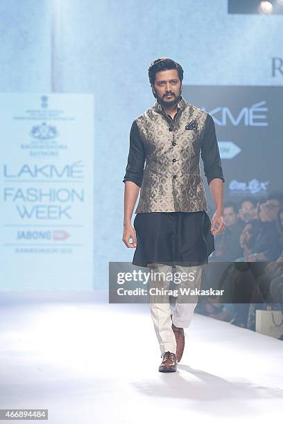 Riteish Deshmukh walks the runway during the Raghavendra Rathore show on day 2 as part of Lakme Fashion Week Summer/Resort 2015 at Palladium Hotel on...