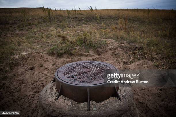 Man hole allowing access to a pipeline for the water source of the town of Winner, SD, is seen near the spot where the proposed Keystone XL pipeline...