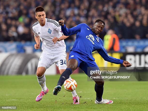 Dynamo Kiev's Ukrainian defender Yevhen Khacheridi of and Everton's Belgian forward Romelu Lukaku vie during the UEFA Europa League round of 16...