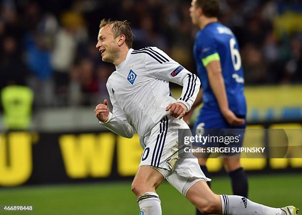 Dynamo Kiev's midfielder Oleg Gusev celebrates after scoring during the UEFA Europa League round of 16 football match between Dynamo Kiev and Everton...