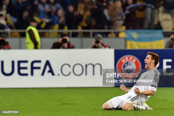 Dynamo Kiev's Portuguese defender Vitorino Antunes celebrates after scoring during the UEFA Europa League round of 16 football match between Dynamo...