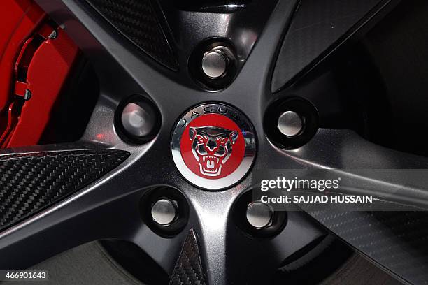 The Jaguar logo is pictured on the wheel of a Project 7 car at the 12th Auto Expo in Greater Noida on February 5, 2014. AFP PHOTO/ SAJJAD HUSSAIN