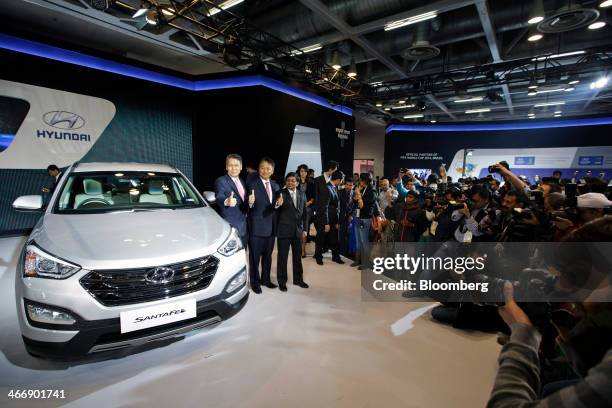 Bo Shin Seo, managing director and chief executive officer of Hyundai Motor India Ltd., left to right, C.H. Han, senior executive director, and...