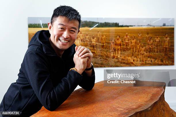 Chinese artist Liu Bolin poses at the galerie Paris-Beijing on March 19, 2015 in Paris, France. Liu Bolin is Internationally known and recognized...