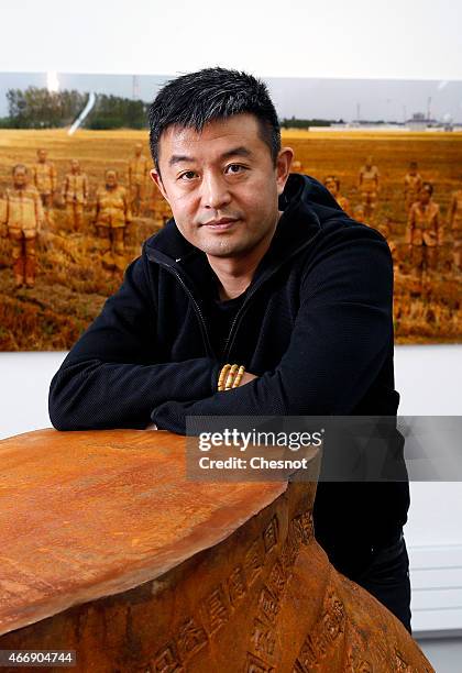 Chinese artist Liu Bolin poses at the galerie Paris-Beijing on March 19, 2015 in Paris, France. Liu Bolin is Internationally known and recognized...