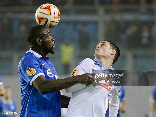 Jose Callejon of Napoli vies with Christopher Samba of Dynamo Moscow during the UEFA Europa League round of 16 second leg football match between...