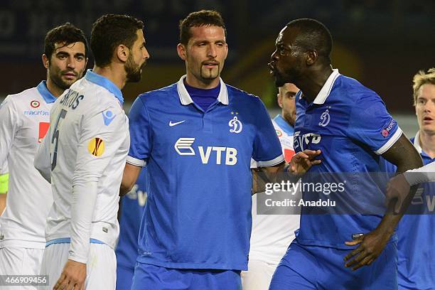 Miguel Britos of Napoli vies with Christopher Samba of Dynamo Moscow during the UEFA Europa League round of 16 second leg football match between...