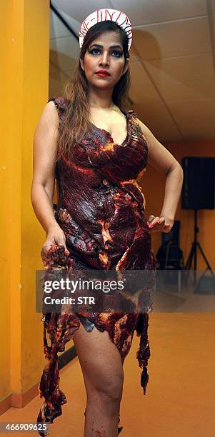 Indian Bollywood film actress Tanisha Singh poses in a real goat meat dress, similiar to one worn by Lady Gaga at the 2010 Video Music Awards, during...