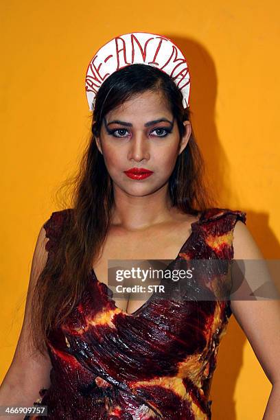 Indian Bollywood film actress Tanisha Singh poses in a real goat meat dress, similiar to one worn by Lady Gaga at the 2010 Video Music Awards, during...