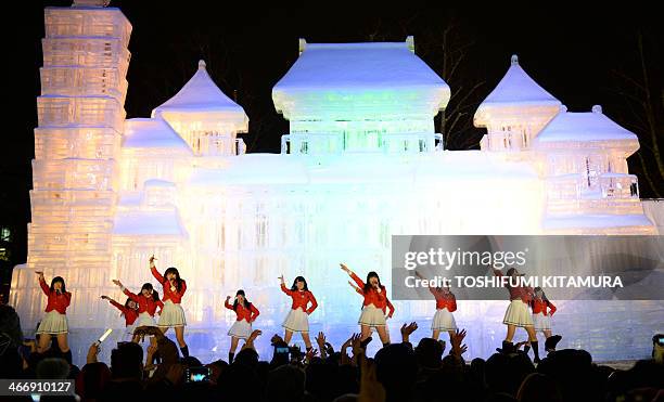 Sapporo's local idol group, Team Crereco performs on a stage in front of a10-metre-tall and 18-metre-wide ice statue of the National Palace Museum in...