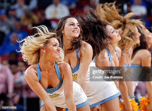 Cheerleaders from the UCLA Bruins performs during the second round of the 2015 NCAA Men's Basketball Tournamenat at the KFC YUM! Center on March 19,...