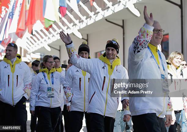 German skeleton athlete Frank Rommel waves while team Germany arrives at Mountain Cluster Olympic Village on February 5, 2014 in Sochi, Russia.