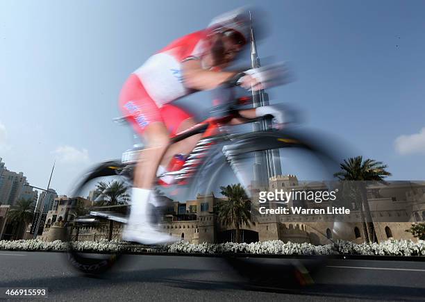 Luca Paolini of Italy and Team Katusha races past the Burj Khalifa during the time trial on stage one of the 2014 Tour of Dubai on February 5, 2014...