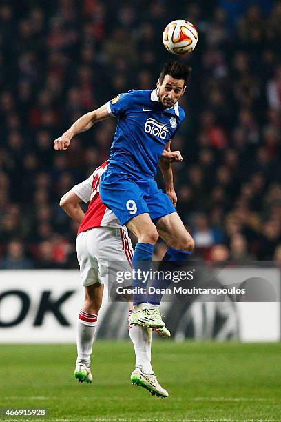 Nikola Kalinic of Dnipro rises above Nick Viergever of Ajax to win a header on goal during the UEFA Europa League Round of 16, second leg match...