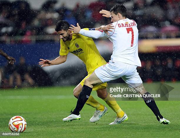 Villarreal's Argentinian defender Mateo Musacchio vies with Sevilla's French forward Kevin Gameiro during the Europa League football match FC Sevilla...