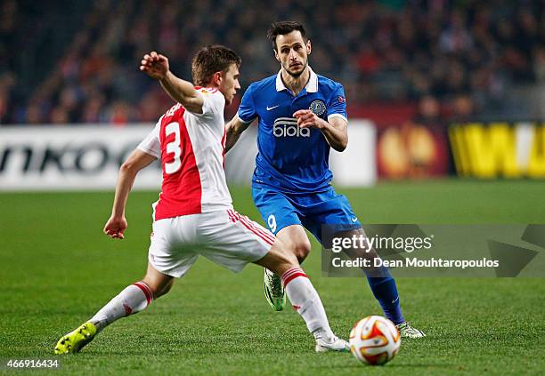 Nikola Kalinic of Dnipro closes down Joel Veltman of Ajax during the UEFA Europa League Round of 16, second leg match between AFC Ajax v FC Dnipro...