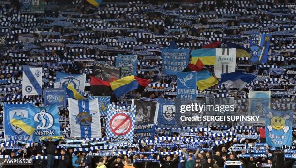 Dynamo Kiev's fans cheer for their team during the UEFA Europa League round of 16 football match between Dynamo Kiev and Everton in Kiev on March 19,...