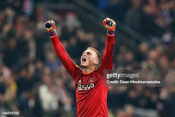 Goalkeeper Jasper Cillessen of Ajax celebrates after teammate Riechedly Bazoer of Ajax scores a goal to level the scores at 1-1 on aggregate during...