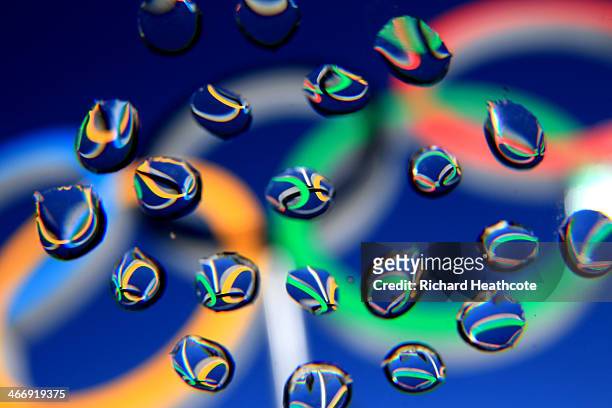 The Olympic Rings are seen in water droplets ahead of the Sochi 2014 Winter Olympics at the Laura Cross-Country Ski and Biathlon Center on February...