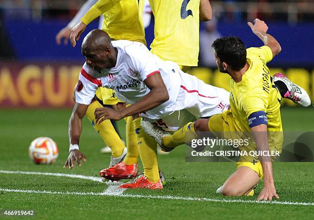 Sevilla's Cameroonian midfielder Stephane Mbia vies with Villarreal's Argentinian defender Mateo Musacchio during the Europa League football match FC...