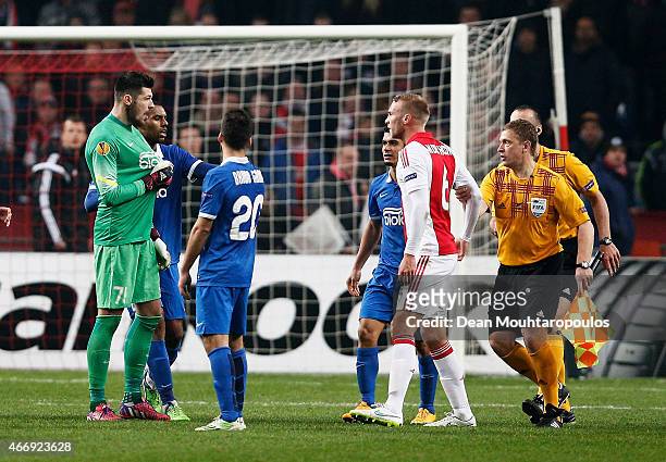 Scuffle breaks out between goalkeeper Denys Boyko of Dnipro and Mike van der Hoorn of Ajax following the final whistle during the UEFA Europa League...