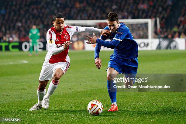 Yevhen Konoplyanka of Dnipro is closed down by Ricardo van Rhijn of Ajax during the UEFA Europa League Round of 16, second leg match between AFC Ajax...