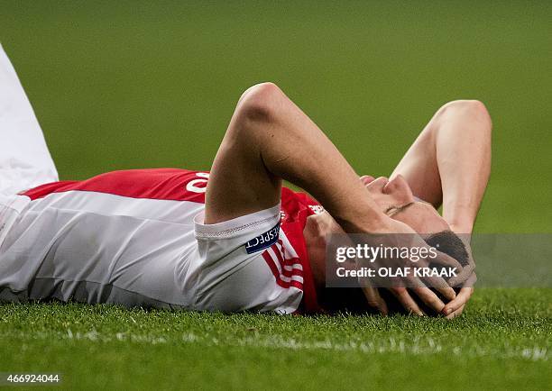 Ajax Amsterdam's Nick Viergever reacts at the end of the UEFA Europa League round of 16 football match between Ajax Amsterdam and Dnipro...