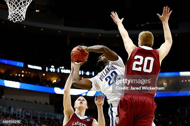 JayVaughn Pinkston of the Villanova Wildcats shoots the ball against Seth Hinrichs and Dan Trist of the Lafayette Leopards in the first half during...