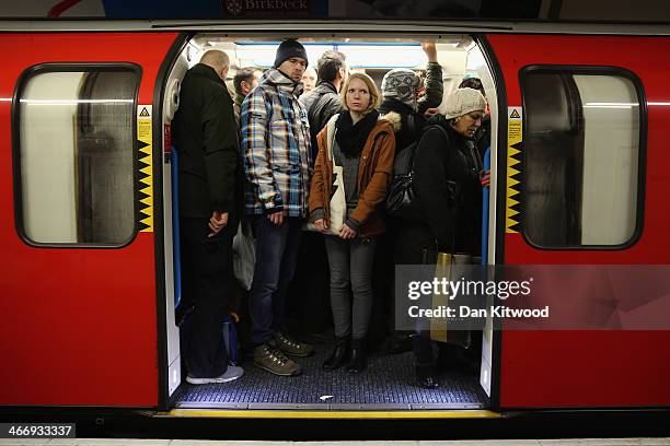 Commuters crowd on to a tube at Oxford Street station on February 5 in London, England. Today marks the first full day of a 48 hour strike by London...