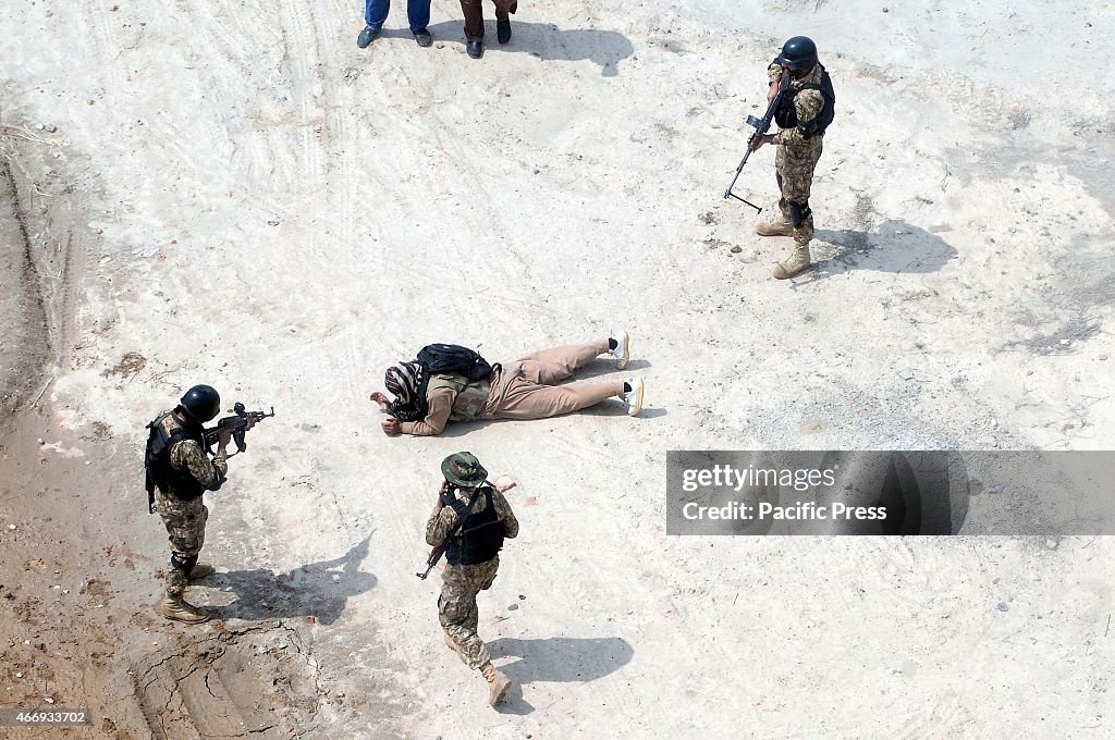 Pakistani soldiers take part in a drill against terrorists...
