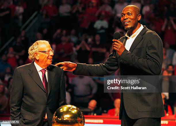 Fomer Houston Rocket Hakeem Olajuwon speaks to the crowd alongside team owner Leslie Alexander as the team honors the 20th anniversary of...