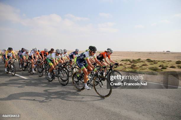 The peloton rides through Al Mazzara during stage two of the 2014 Ladies Tour of Qatar from Al Zubara to Madinat Al Shamal on February 5, 2014 in...