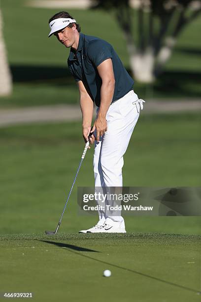 Jamie Lovemark plays the 18th hole at La Quinta Country Club Course during the first round of the Humana Challenge in partnership with the Clinton...