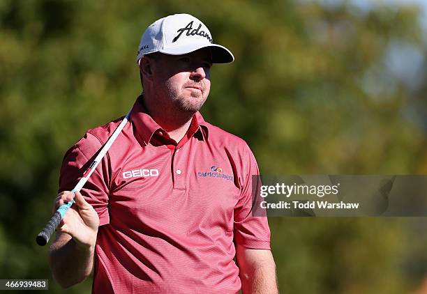 Robert Garrigus hits a shot on the 7th hole at La Quinta Country Club Course during the first round of the Humana Challenge in partnership with the...