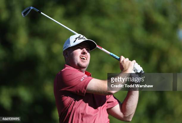 Robert Garrigus hits a shot on the 7th hole at La Quinta Country Club Course during the first round of the Humana Challenge in partnership with the...