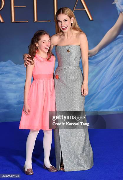 Eloise Webb and Lily James attend the UK Premiere of "Cinderella" at Odeon Leicester Square on March 19, 2015 in London, England.