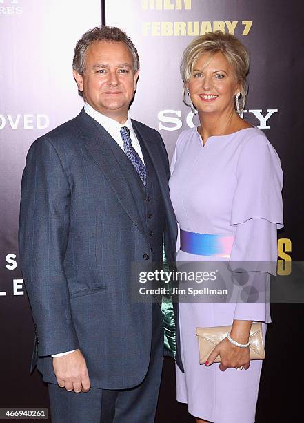 Actor Hugh Bonneville and wife Lulu Williams attend the "Monument Men" premiere at Ziegfeld Theater on February 4, 2014 in New York City.